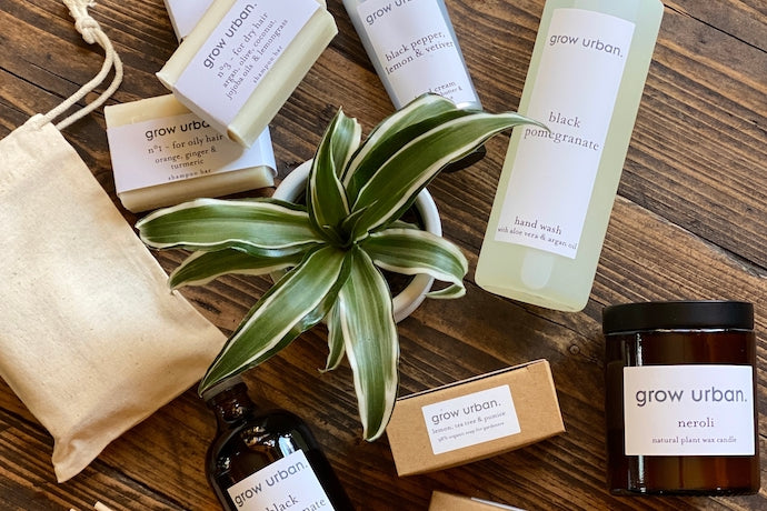 Branded grow urban products on display with a houseplant