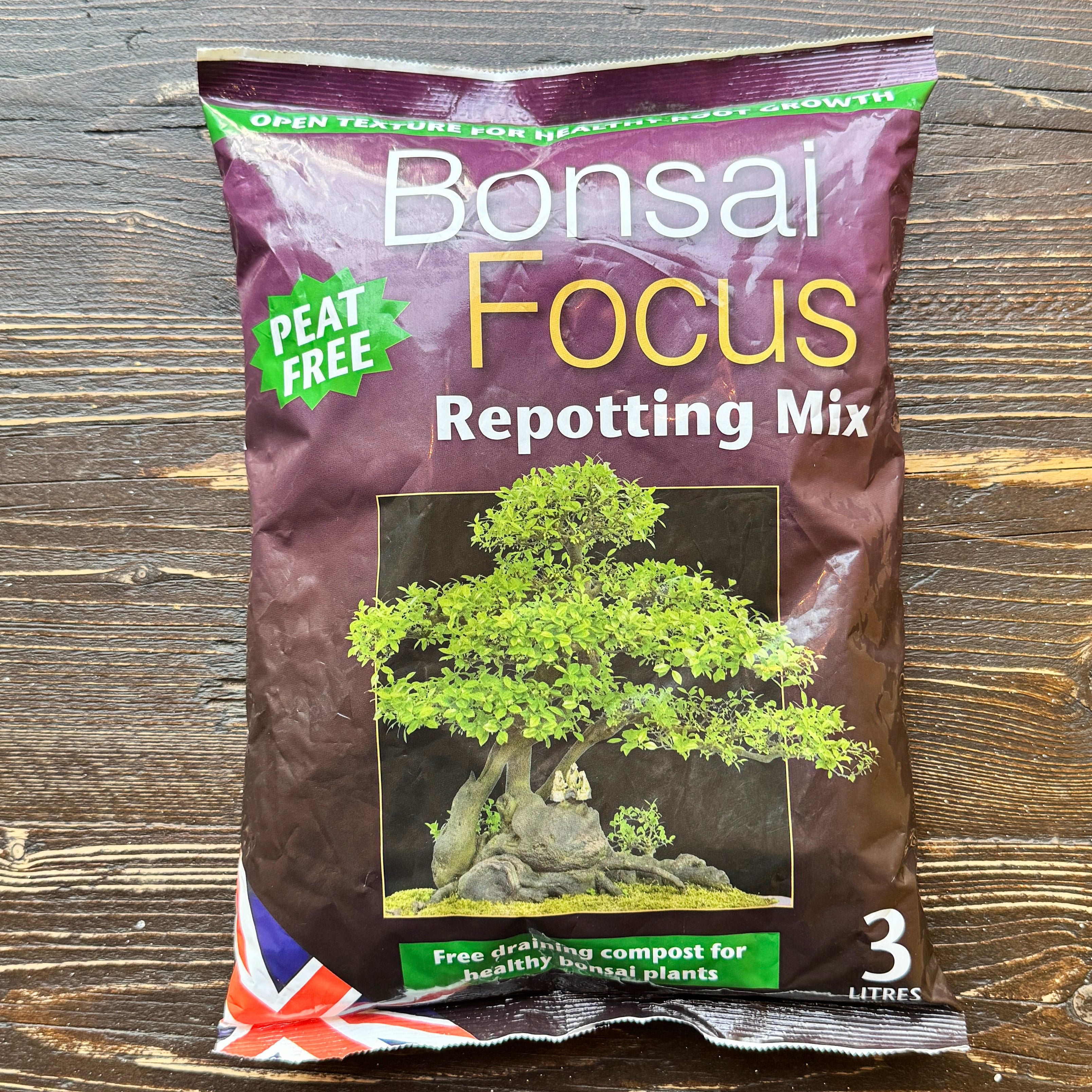 Bag of Bonsai Focus Repotting Mix on a wooden surface
