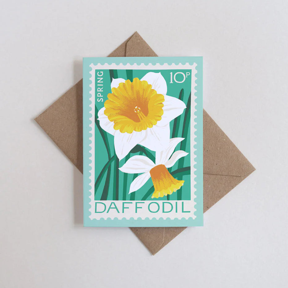 Card with daffodil design and envelope on a light gray background