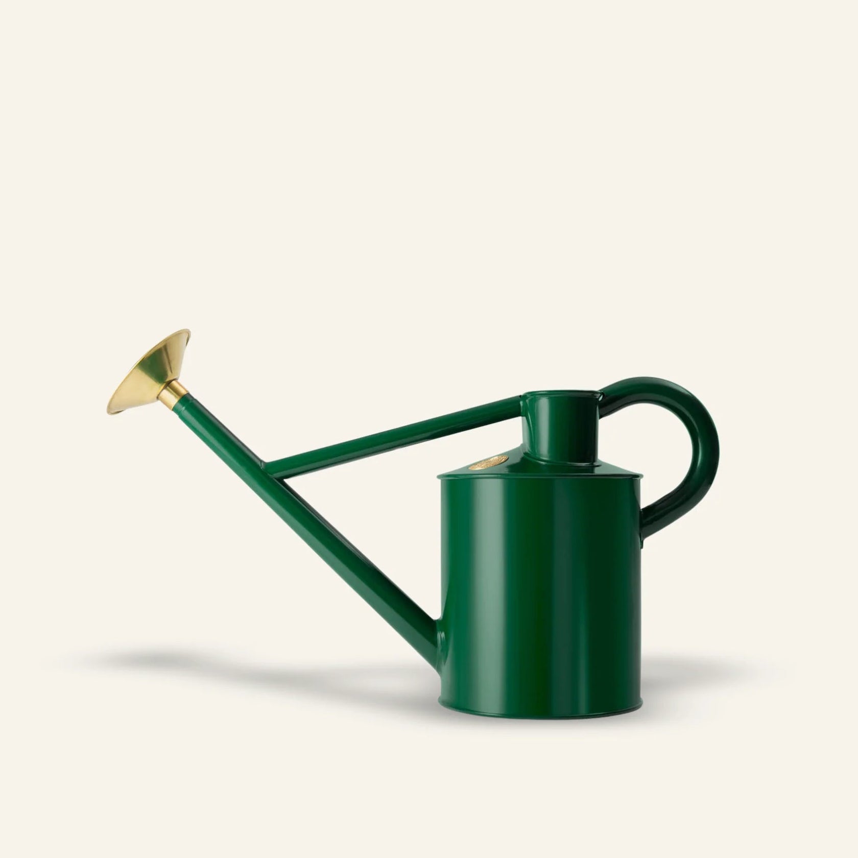 Haws green watering can with brass nozzle on a white background