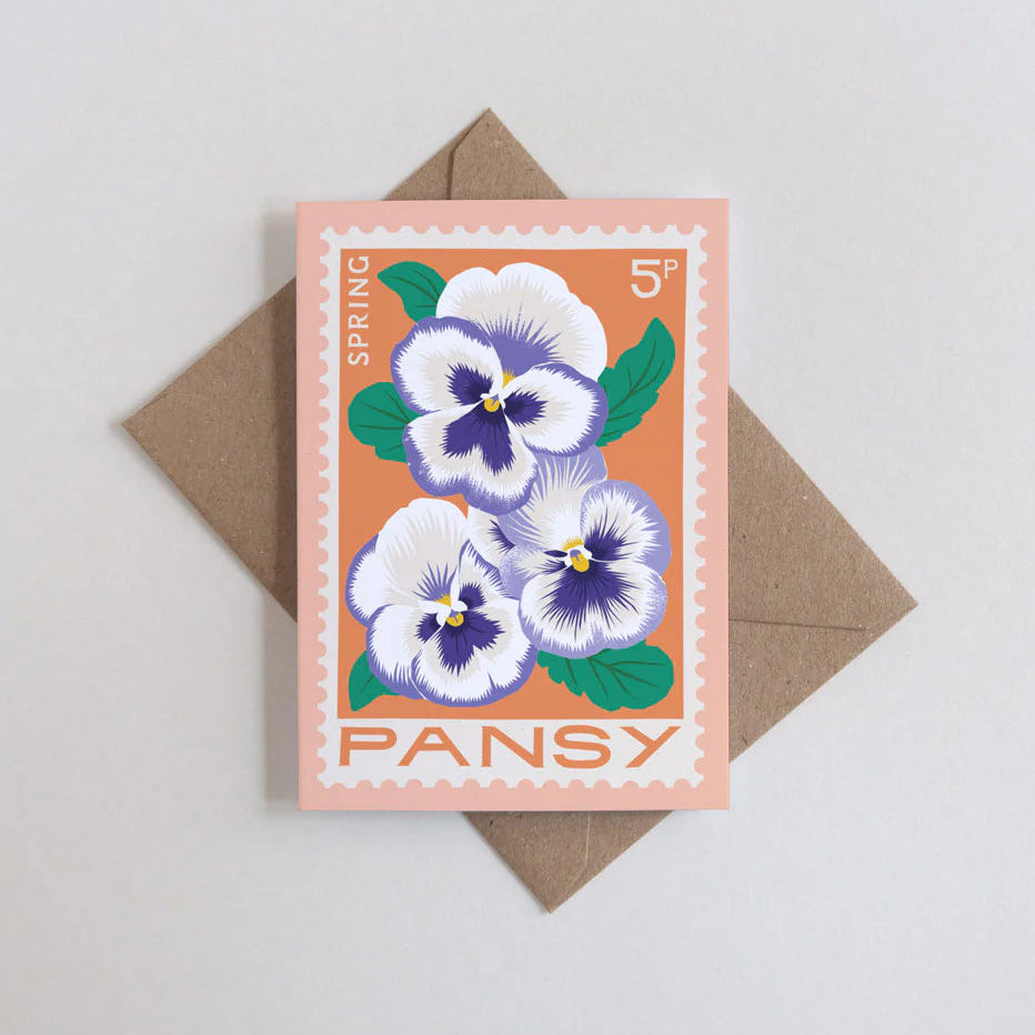 Card with pansy design and envelope on a light gray background